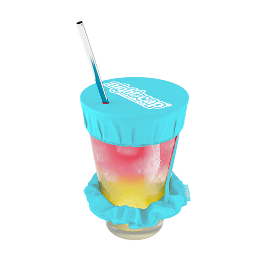 Colorful drink in a clear cup with a Teal lid and straw on a white background